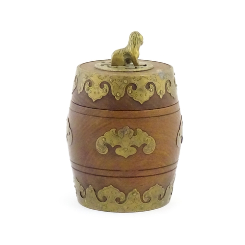 1047 - A Chinese tobacco jar of barrel form with stylised bat brass mounts and foo dog finial. Approx. 6 3/... 