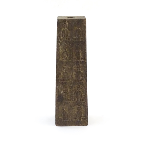 1049 - An Asian composite stone column / base of tapering form decorated with figures and a pagoda style bu... 