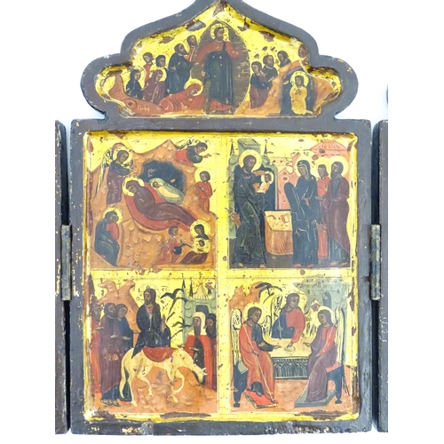 1050 - A 19thC Russian Orthodox carved wooden triptych icon with eight tempera depictions of events in the ... 