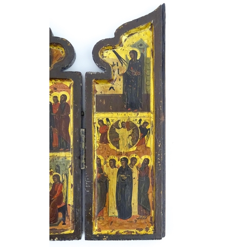 1050 - A 19thC Russian Orthodox carved wooden triptych icon with eight tempera depictions of events in the ... 