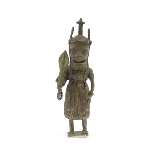 1076 - Ethnographic / Native / Tribal : A cast Benin bronze figure depicting the Oba of Benin holding a swo... 