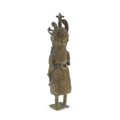 1076 - Ethnographic / Native / Tribal : A cast Benin bronze figure depicting the Oba of Benin holding a swo... 