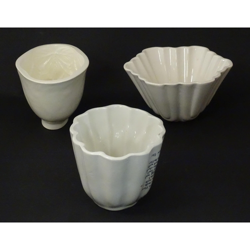 1080 - Three early 20thC ceramic jelly / blancmange moulds, to include a Copeland example with strawberry d... 