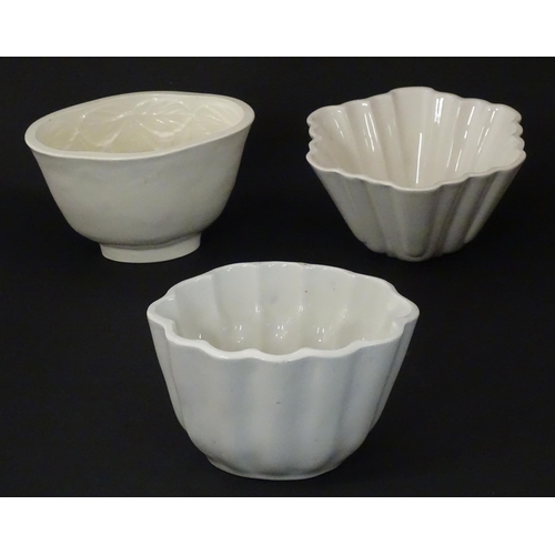 1080 - Three early 20thC ceramic jelly / blancmange moulds, to include a Copeland example with strawberry d... 