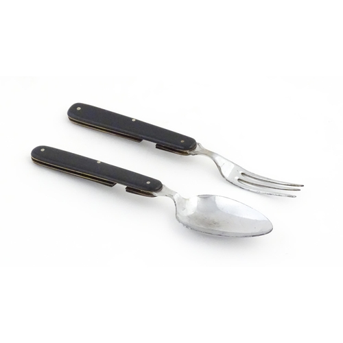 1085 - A 20thC campaign style folding spoon and fork. (2)