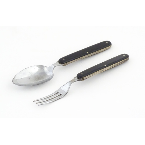 1085 - A 20thC campaign style folding spoon and fork. (2)