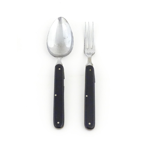 1085 - A 20thC campaign style folding spoon and fork. (2)