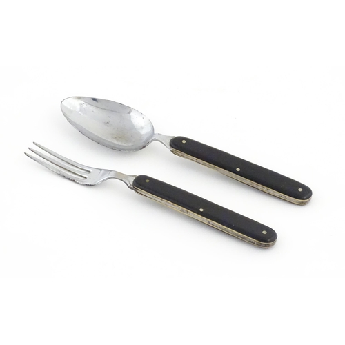 1085 - A 20thC campaign style folding spoon and fork. (2)