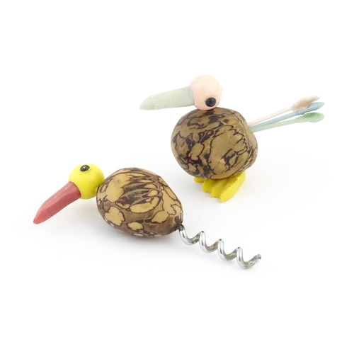 1086 - A 20thC novelty corkscrew and novelty cocktail stick holder each modelled as stylised parrots / bird... 