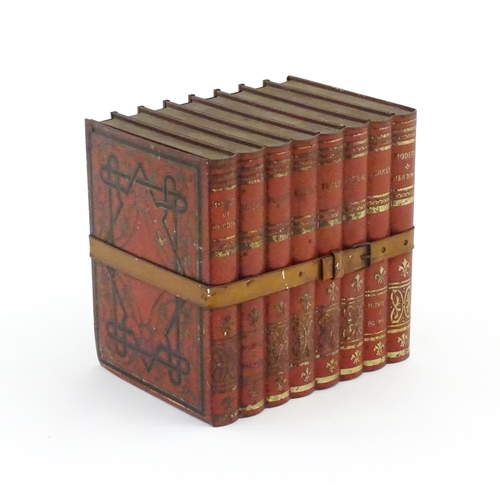 1087 - A 20thC Huntley & Palmers advertising novelty biscuit tin formed as eight leather books with binding... 