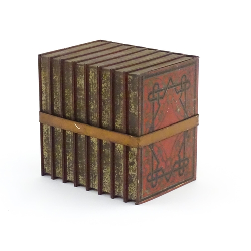 1087 - A 20thC Huntley & Palmers advertising novelty biscuit tin formed as eight leather books with binding... 