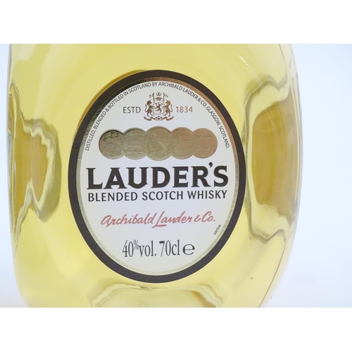 1101 - A 70cl bottle of Lauder's Scotch whisky, together with a boxed 700ml bottle of Courvoisier Luxe cogn... 