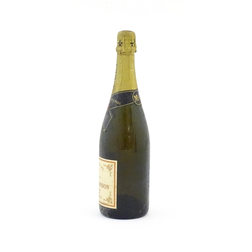 1102 - A 1975 75cl bottle of Moet & Chandon dry imperial champagne.