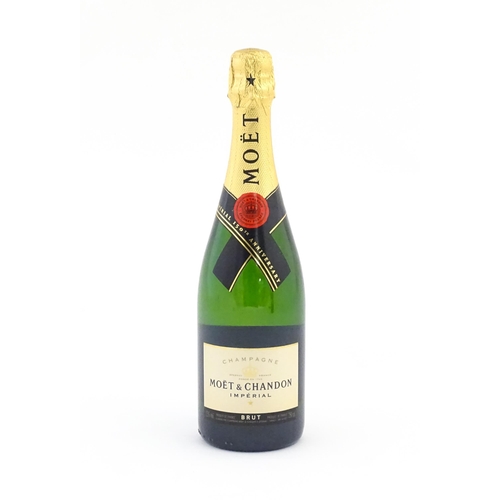 1103 - A 150th Anniversary 750ml bottle of Moet & Chandon brut champagne.