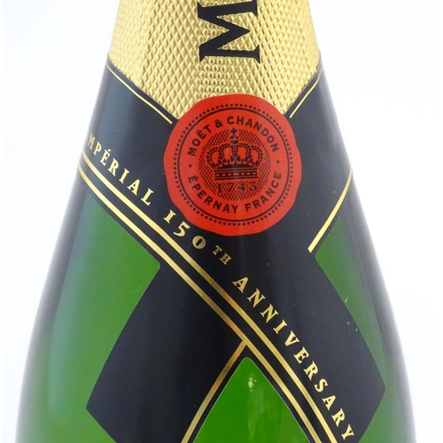 1103 - A 150th Anniversary 750ml bottle of Moet & Chandon brut champagne.