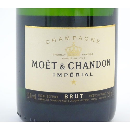 1103 - A 150th Anniversary 750ml bottle of Moet & Chandon brut champagne.