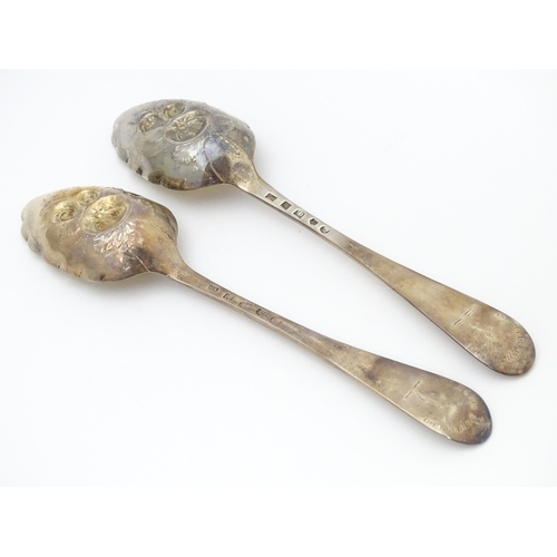 545 - A pair of Geo III Scottish silver berry spoons with engraved armorial to handle, hallmarked Edinburg... 