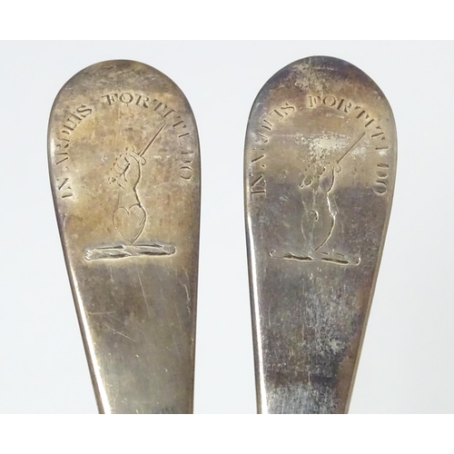 545 - A pair of Geo III Scottish silver berry spoons with engraved armorial to handle, hallmarked Edinburg... 