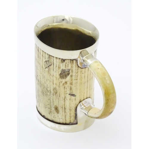 546 - A christening mug the body formed from antler with silver plate mounts. Approx. 4