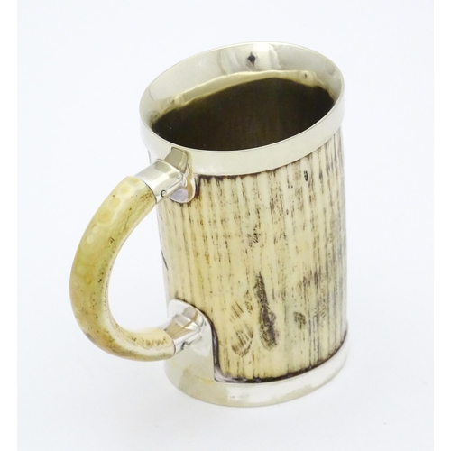 546 - A christening mug the body formed from antler with silver plate mounts. Approx. 4