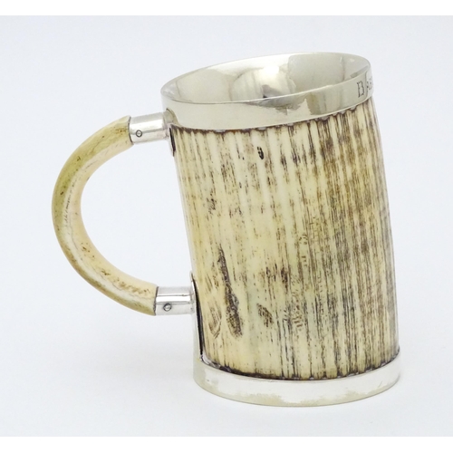 546 - A christening mug the body formed from antler with silver plate mounts. Approx. 4