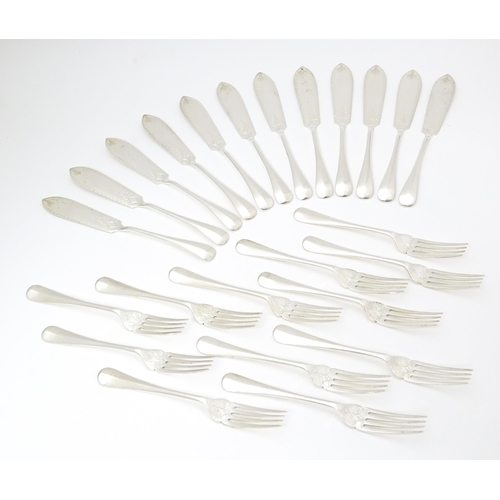 547 - A Victorian twelve place set of silver fish eats, comprising 12 knives and 12 forks, hallmarked Shef... 