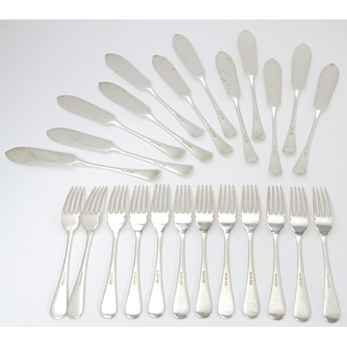 547 - A Victorian twelve place set of silver fish eats, comprising 12 knives and 12 forks, hallmarked Shef... 