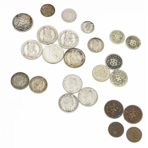 789 - Coins: A quantity of assorted coins from Switzerland to include some silver examples (24)