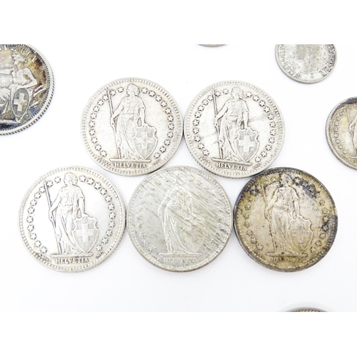 789 - Coins: A quantity of assorted coins from Switzerland to include some silver examples (24)