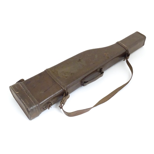 1215 - An early to mid 20thC 'Leg o' Mutton' gun case, of leather construction with sling, the interior wit... 