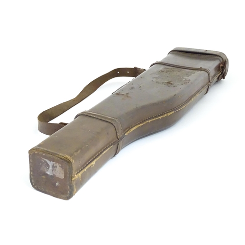 1215 - An early to mid 20thC 'Leg o' Mutton' gun case, of leather construction with sling, the interior wit... 