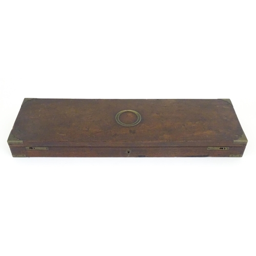 1216 - A 19thC mahogany gun motor case brass mounts, the green baize-lined interior fitted for a side by si... 