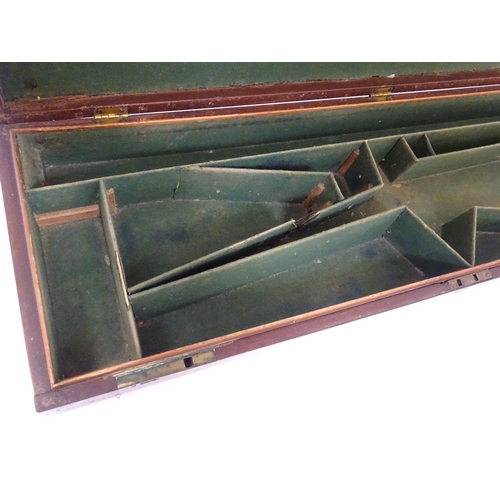 1216 - A 19thC mahogany gun motor case brass mounts, the green baize-lined interior fitted for a side by si... 