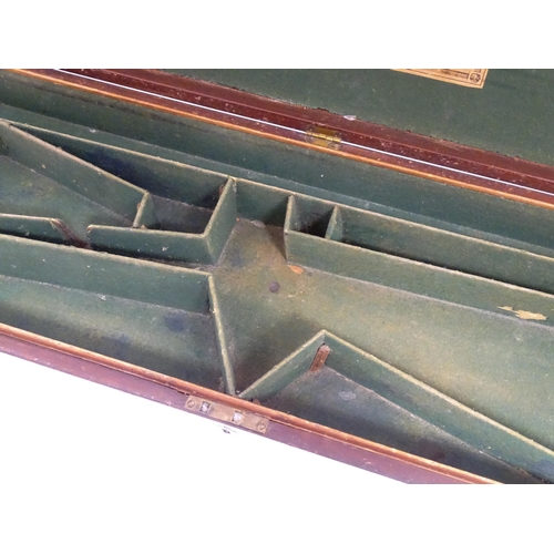 1216 - A 19thC mahogany gun motor case brass mounts, the green baize-lined interior fitted for a side by si... 