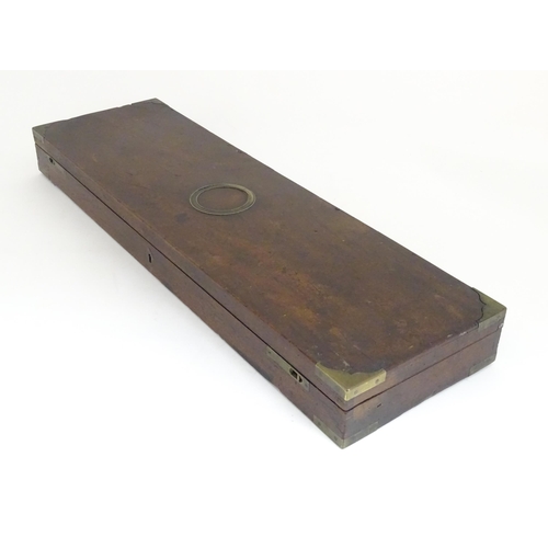 1216 - A 19thC mahogany gun motor case brass mounts, the green baize-lined interior fitted for a side by si... 