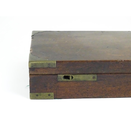 1216 - A 19thC mahogany gun motor case brass mounts, the green baize-lined interior fitted for a side by si... 