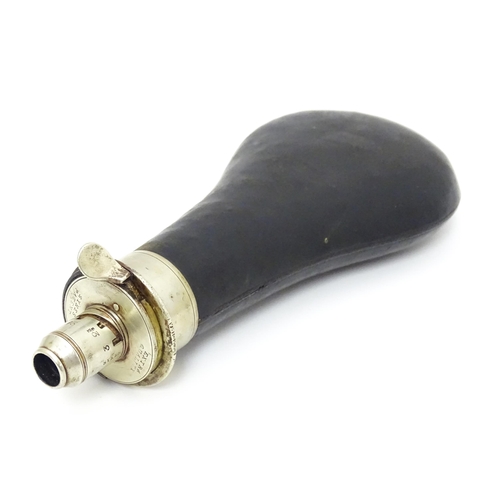 1219 - A 19thC Sykes Patent 'Extra Quality' powder flask, with leather covered reservoir and polished metal... 