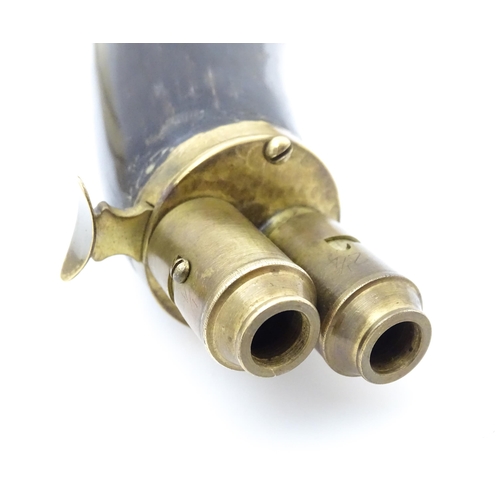 1221 - A 20thC double powder flask, constructed from horn with brass fittings and 2 1/2 - 3 dram measures. ... 