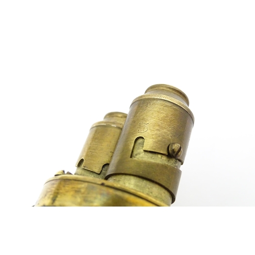 1221 - A 20thC double powder flask, constructed from horn with brass fittings and 2 1/2 - 3 dram measures. ... 