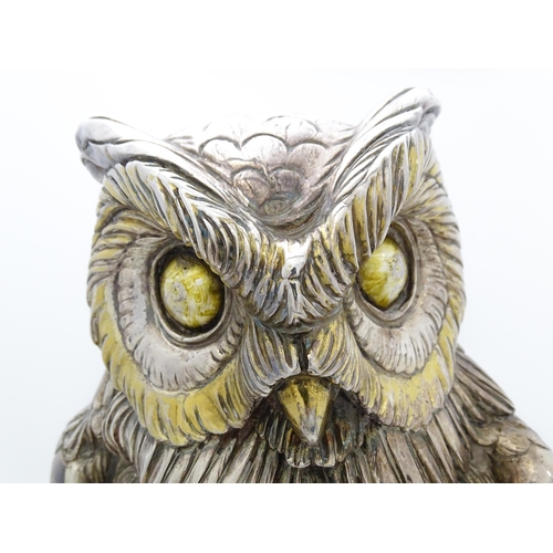 433 - A large filled model of an owl with silver and white metal covering. Signed 'A. Giannelli 1972'. App... 