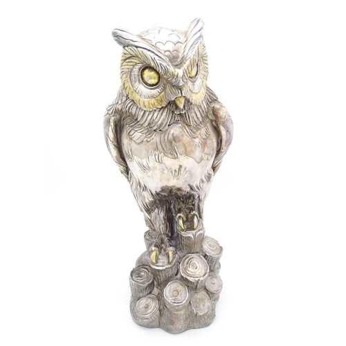 433 - A large filled model of an owl with silver and white metal covering. Signed 'A. Giannelli 1972'. App... 