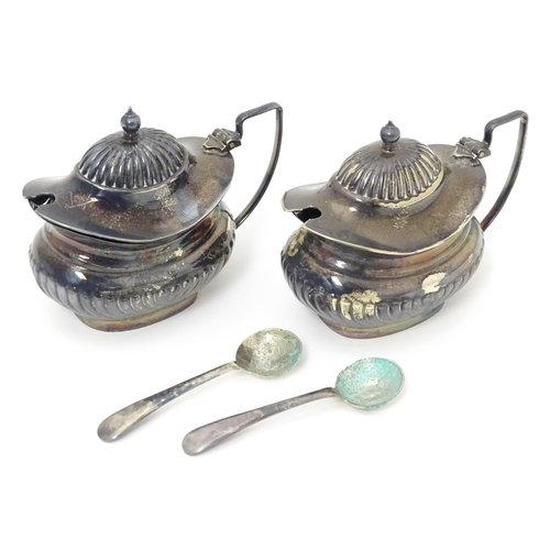 598 - A silver plate cruet set comprising two mustard pots, two salts and two peppers  with 4 associated s... 