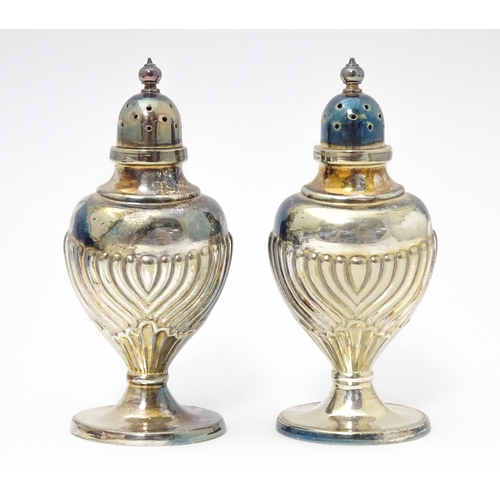 598 - A silver plate cruet set comprising two mustard pots, two salts and two peppers  with 4 associated s... 