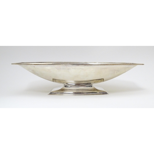 601 - An Art Deco silver plate dish with pedestal foot. Maker I S Greenberg & Co