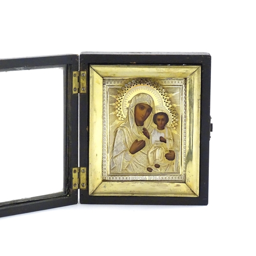 1053 - A late 19th / early 20thC Russian icon depicting Madonna and Child, the Virgin Mary and Jesus Christ... 