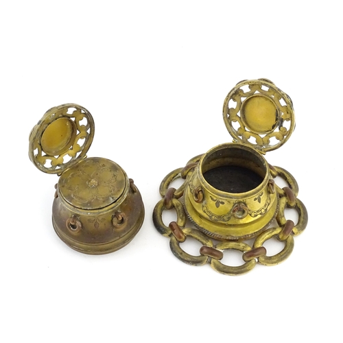 1107 - Two Victorian brass inkwells of capstan form, with chain link detail and applied malachite cabochon ... 