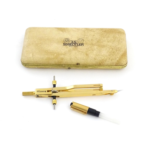 1111 - A cased J. S. Staedtler (commemorative 1835-1985, 150th anniversary) compass with gilt finish, appro... 