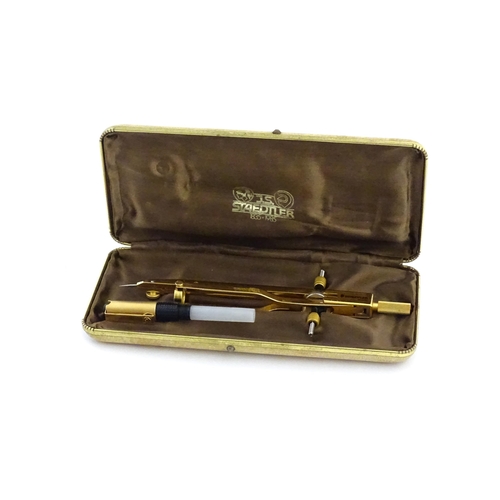 1111 - A cased J. S. Staedtler (commemorative 1835-1985, 150th anniversary) compass with gilt finish, appro... 