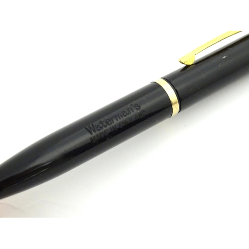 1112 - A c1950 boxed Waterman's Champion 501 black fountain pen with 14ct gold W-2B nib, matching propellin... 