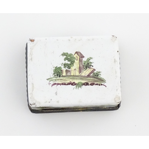 1129 - A late 19th / early 20thC enamel snuff box of rectangular form decorated with a landscape scene with... 